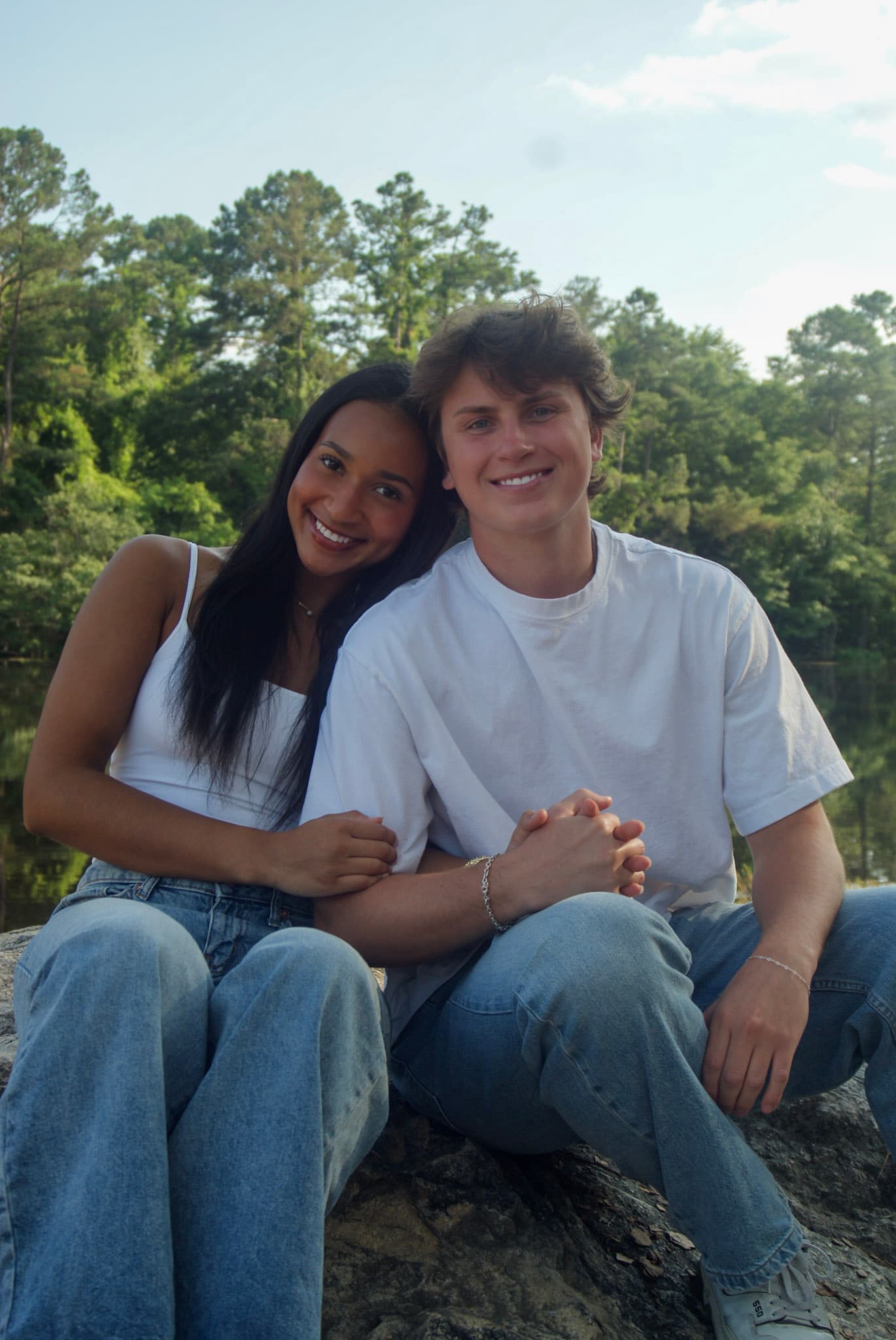Seated couple portrait by the water