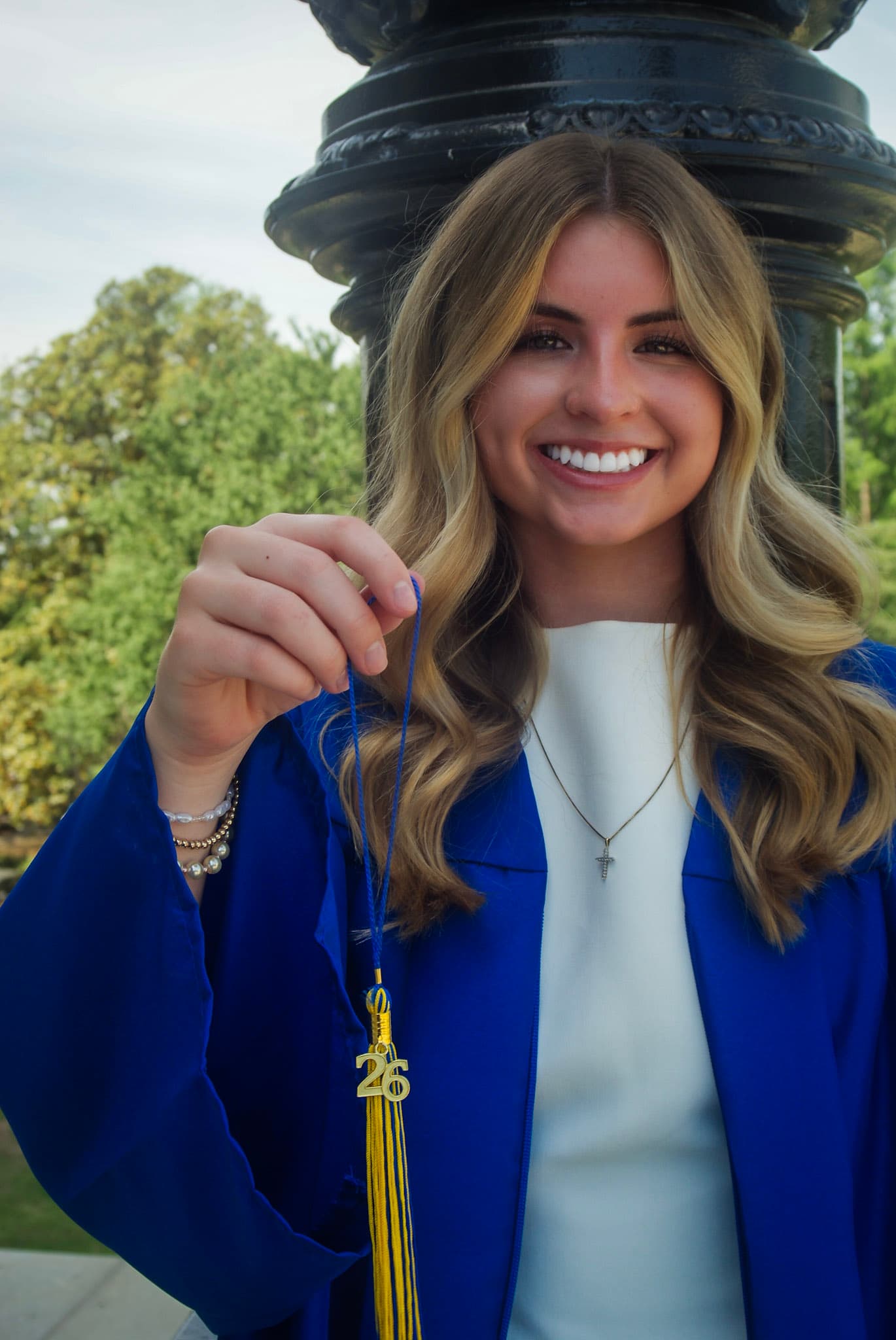 Graduate portrait with polished campus session styling